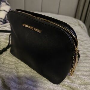Michael Kors Elegant Black Crossbody Bag with Gold Accents
